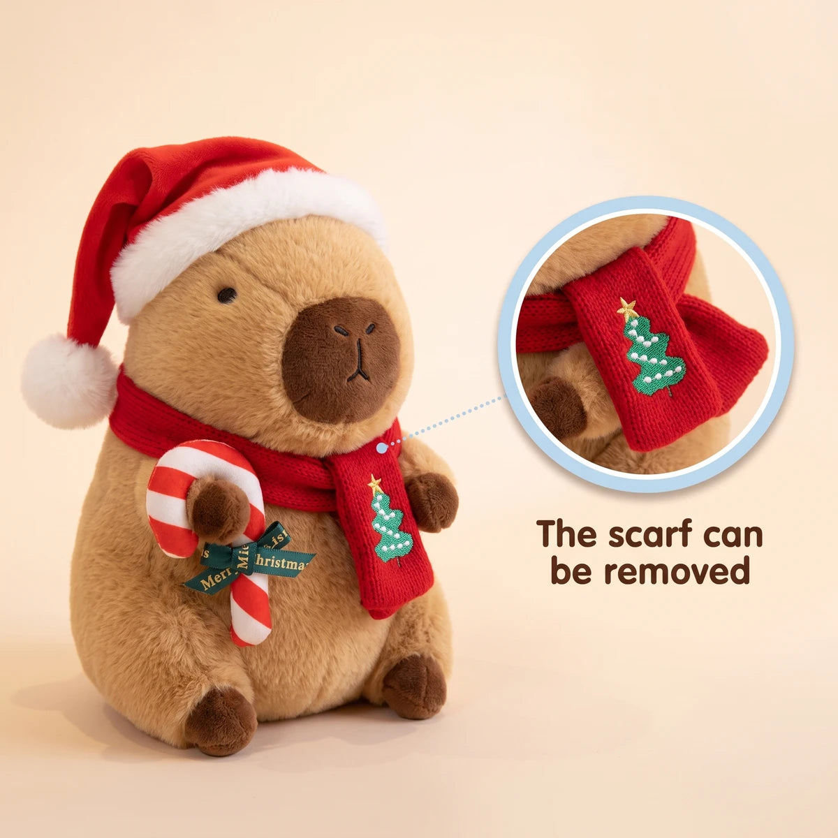Christmas capybara plush with a Santa hat holding a candy cane with a close-up showing that the scarf can be removed