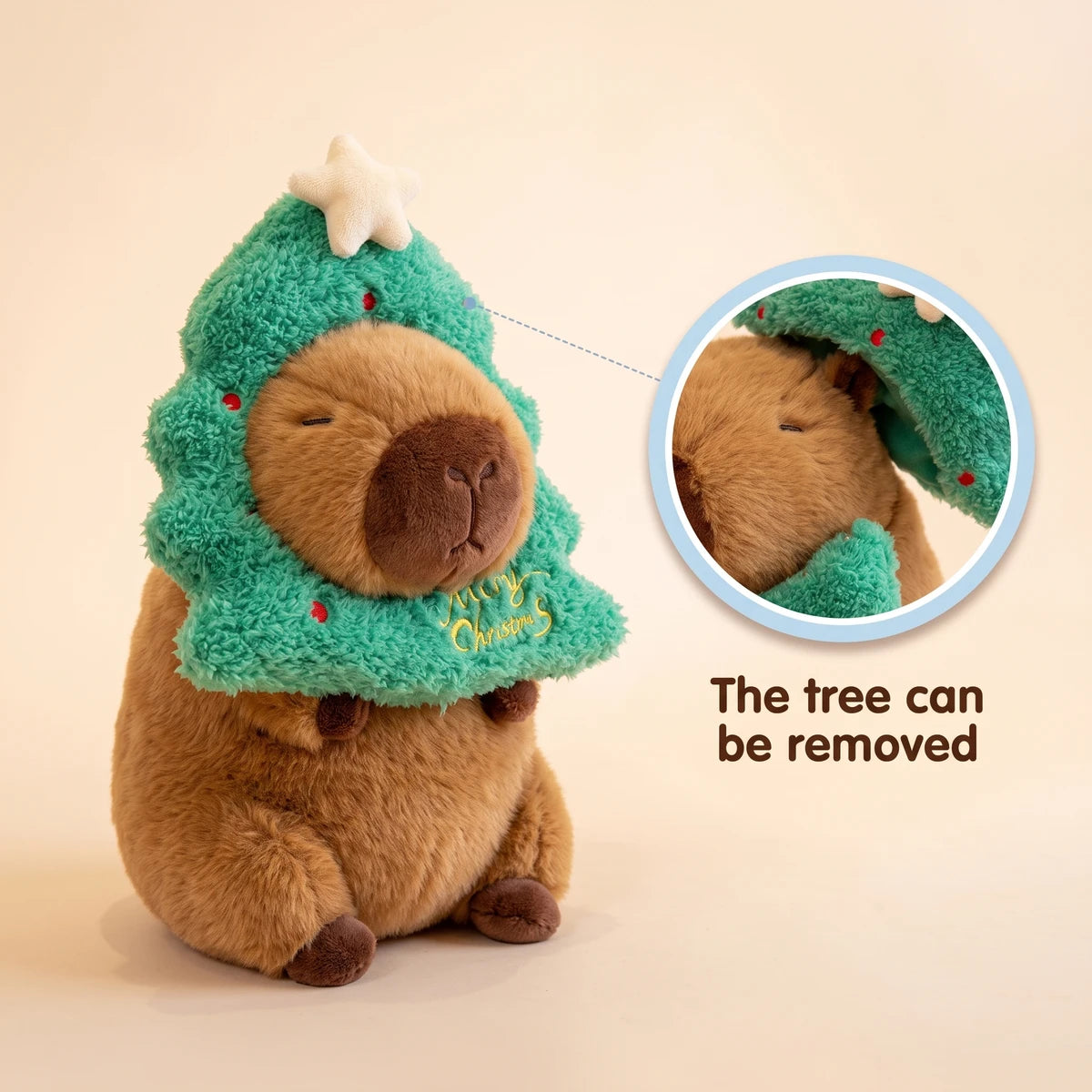Christmas tree capybara plush with a close-up showing that the tree hood can be removed