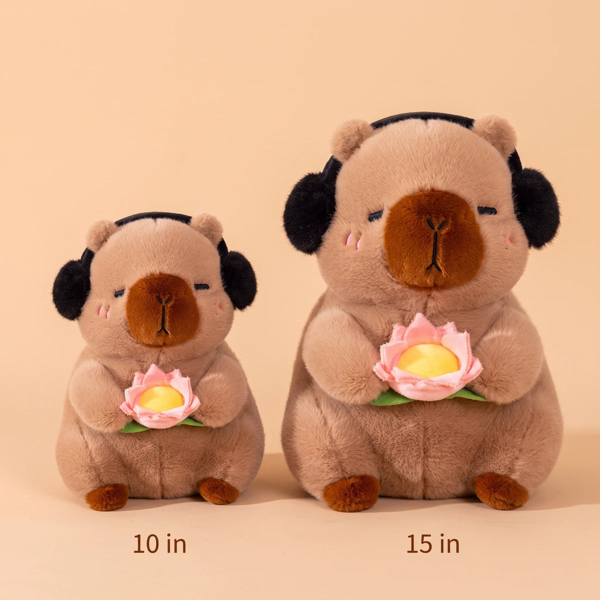 Brown headphones capybara plush in two sizes side by side, 10 in and 15 in