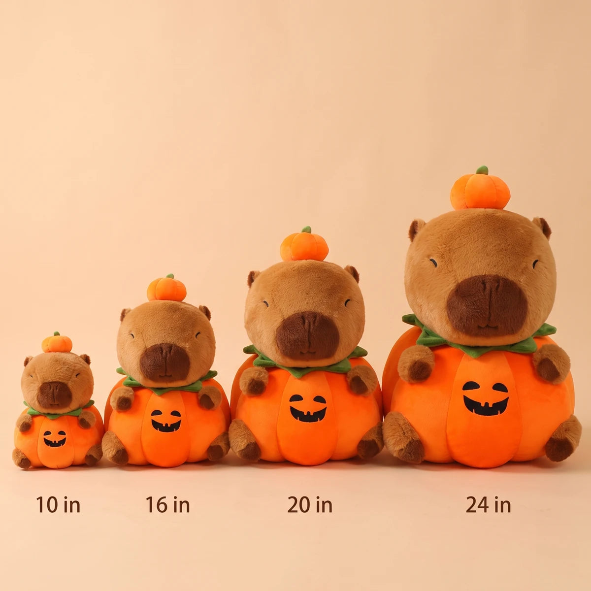 Pumpkin capybara plush in four sizes side by side, 10 in, 16 in, 20 in and 24 in