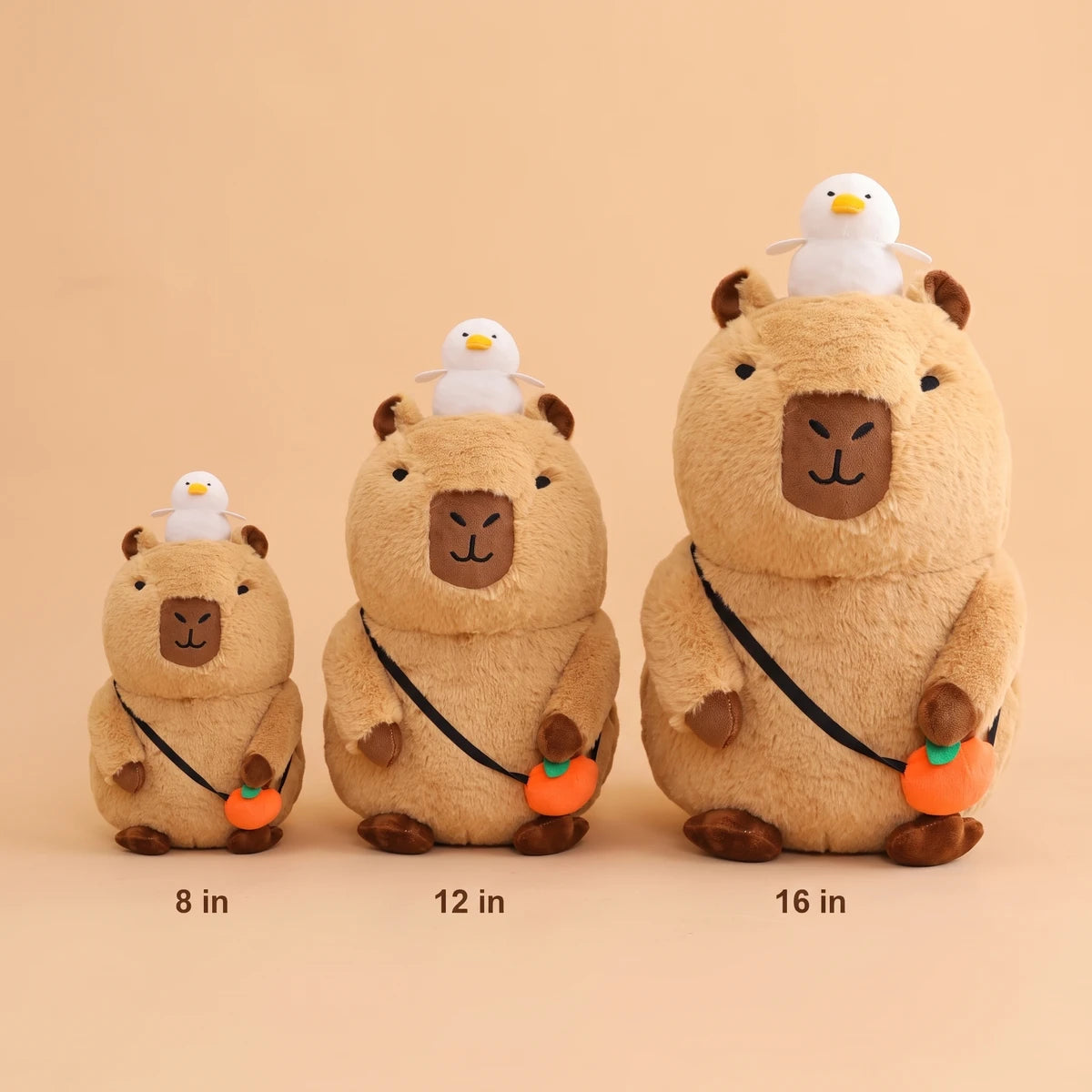 Capybara plush with orange bag in three sizes: 8 in, 12 in and 16 in
