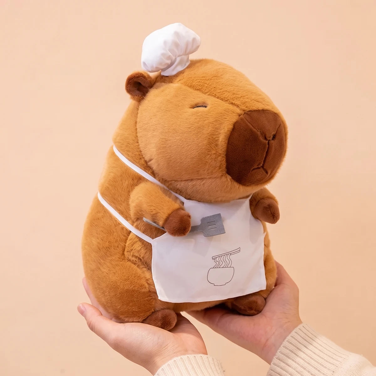 11 in ramen chef capybara plush held in two hands