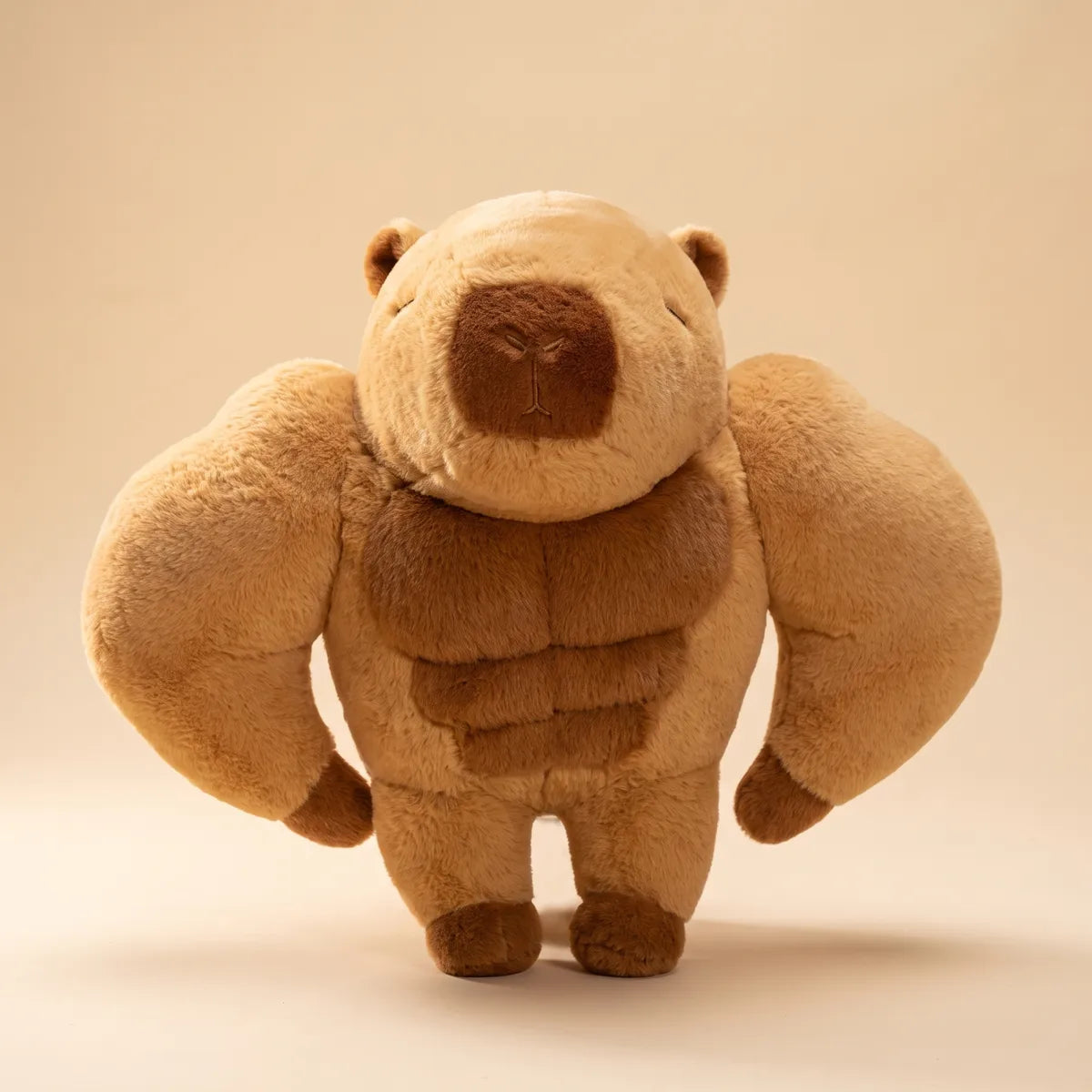 Buff capybara plush from the front, huge sculpted arms out wide and a darker stitched six pack on the belly