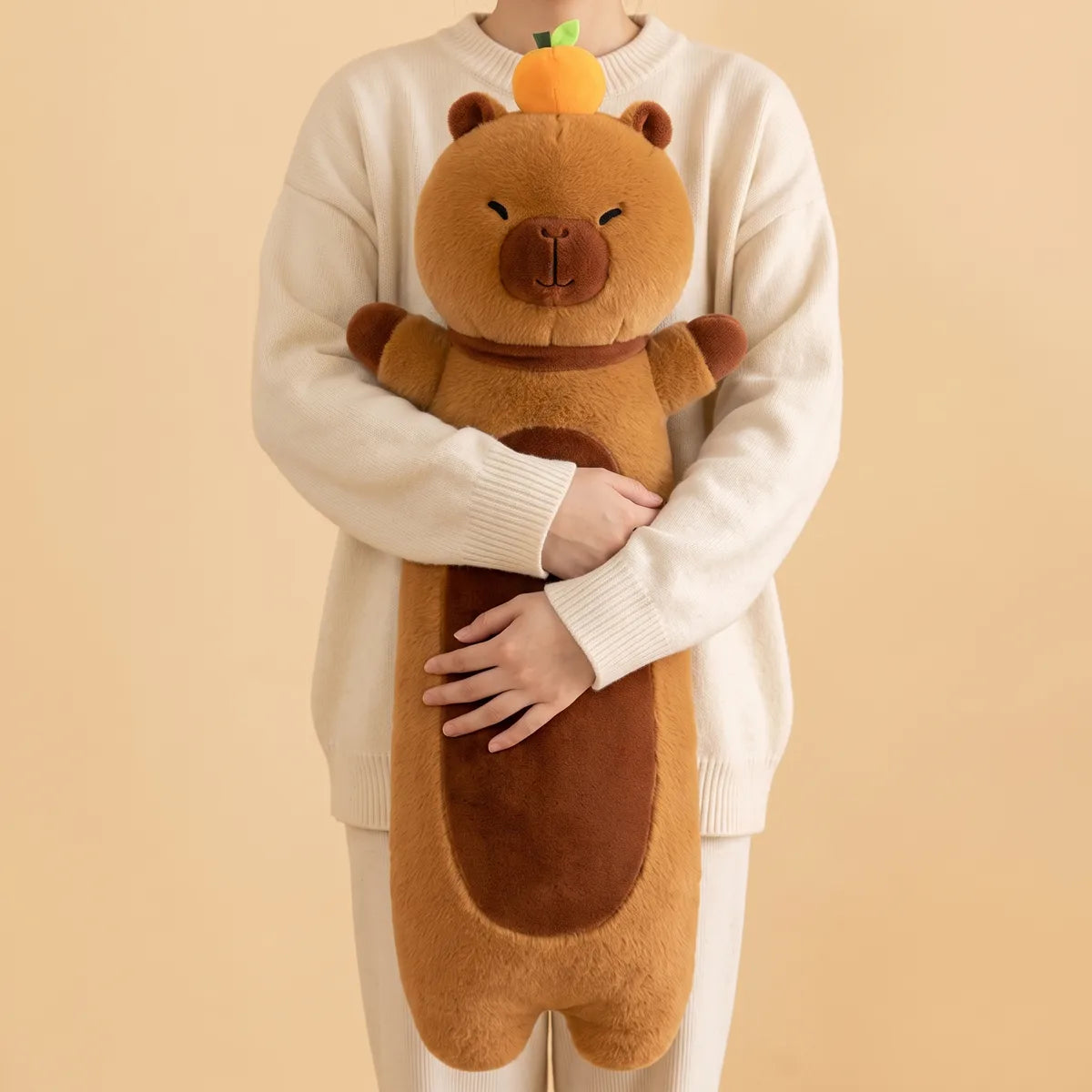Person hugging the capybara body pillow plush with both arms