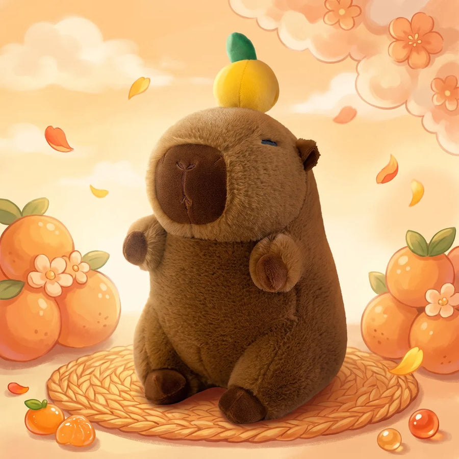 Capybara with orange on head plush seated in an illustrated citrus scene, the fruit balanced on its crown