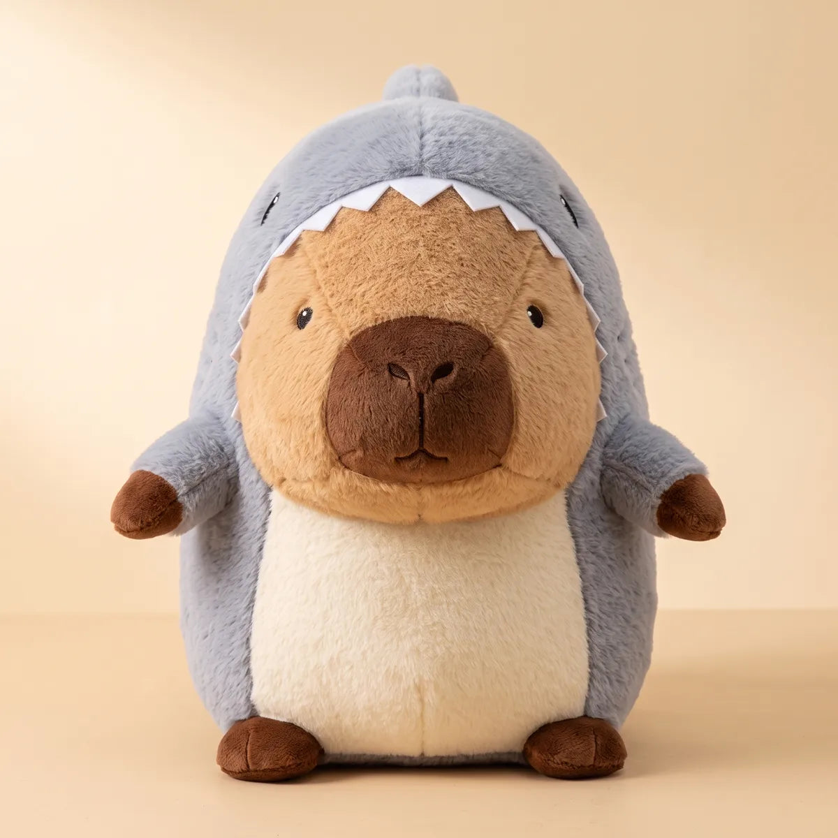 Grey giant shark capybara plush seen from the front with felt teeth and a white belly