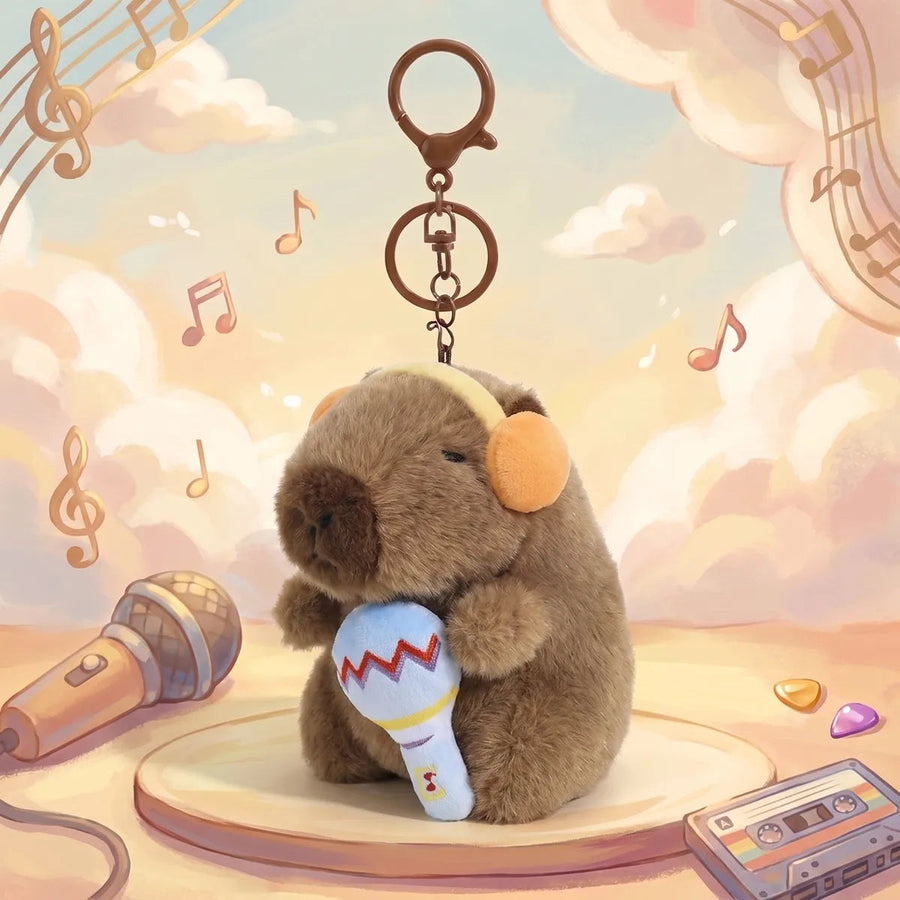 Microphone capybara keychain shown in an illustrated music stage scene