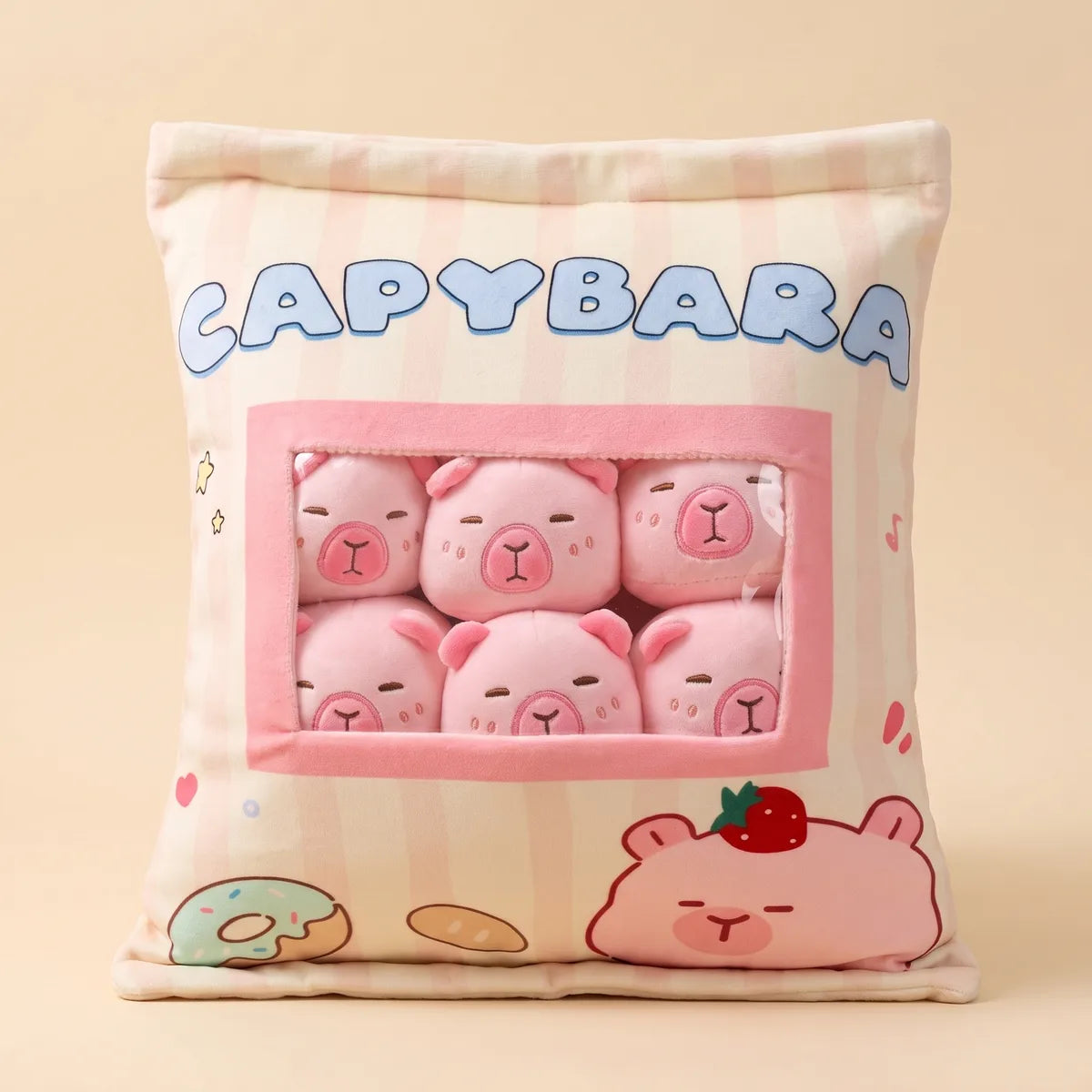 Front of the pink mini capybara plush set: six minis behind the clear window of a striped CAPYBARA snack bag pillow