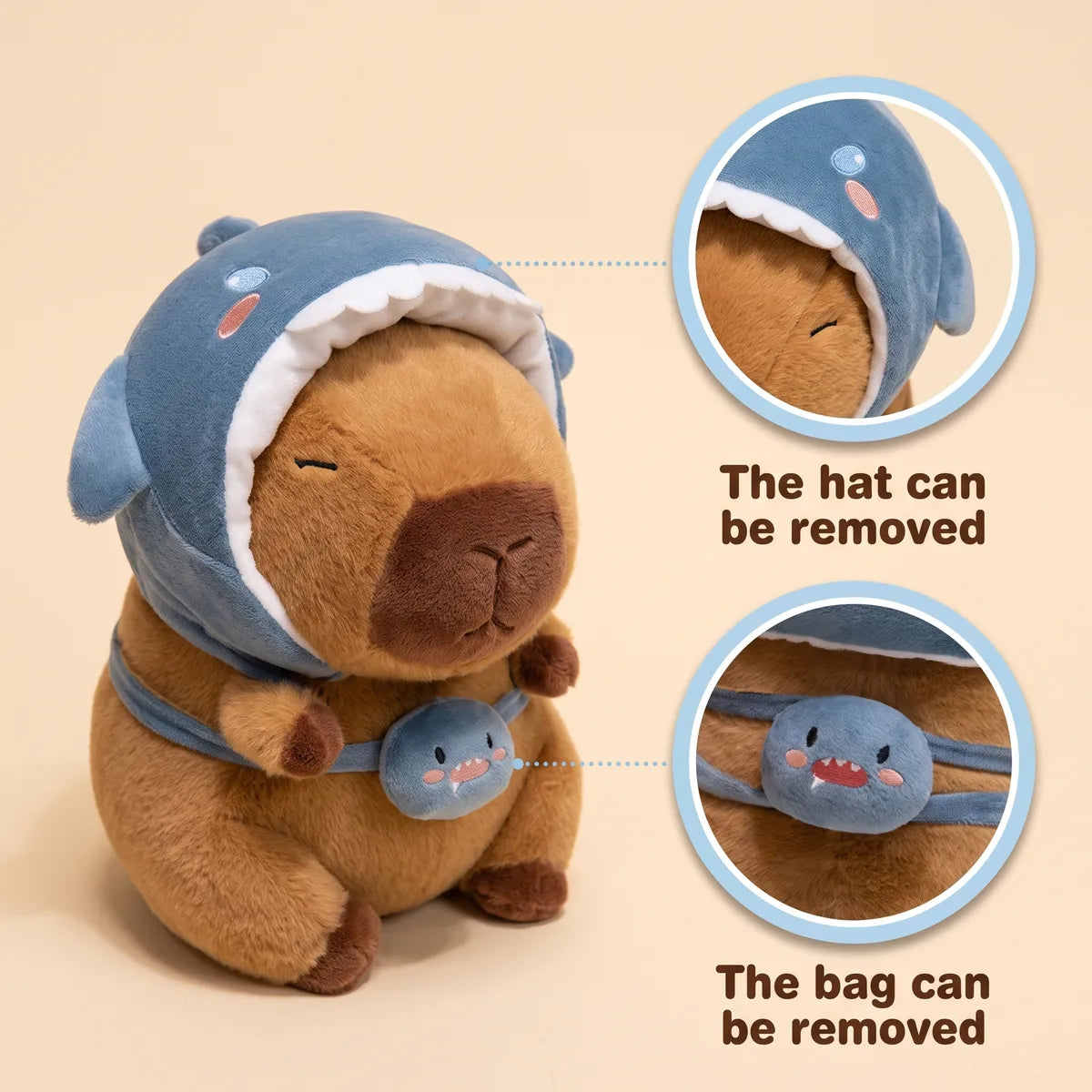 Shark hat capybara plush shown with its removable shark hood and its removable shark bag