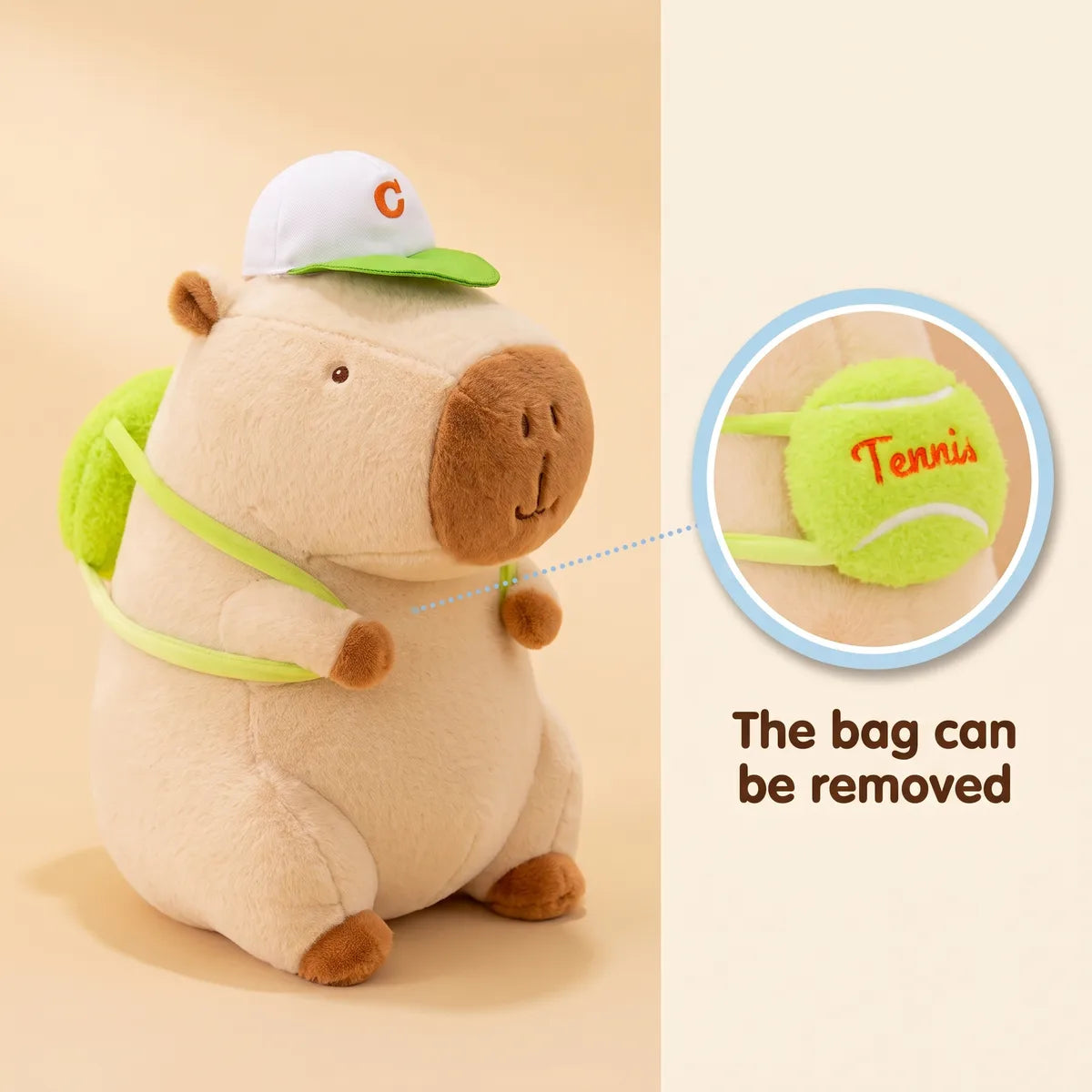 White tennis backpack capybara plush with a close up of the removable tennis ball backpack
